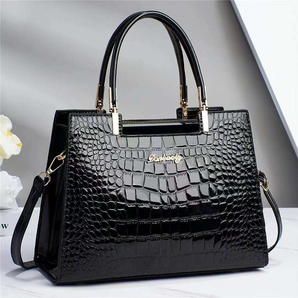 Wilja | Shiny leather handbag with crocodile pattern