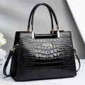 Wilja | Shiny leather handbag with crocodile pattern