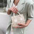 Woven handbag with floral accents - Serena