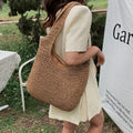 Round straw shoulder bag - Shreya