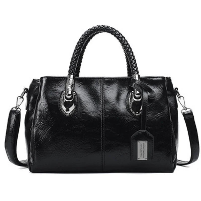 Pia | "Elegant leather handbag with braided handle".