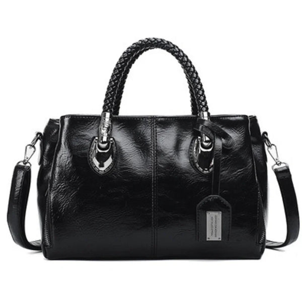Pia | "Elegant leather handbag with braided handle".