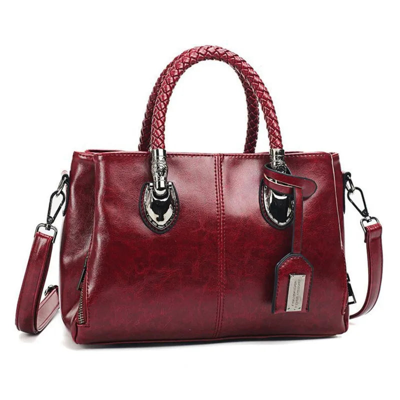 Pia | "Elegant leather handbag with braided handle".