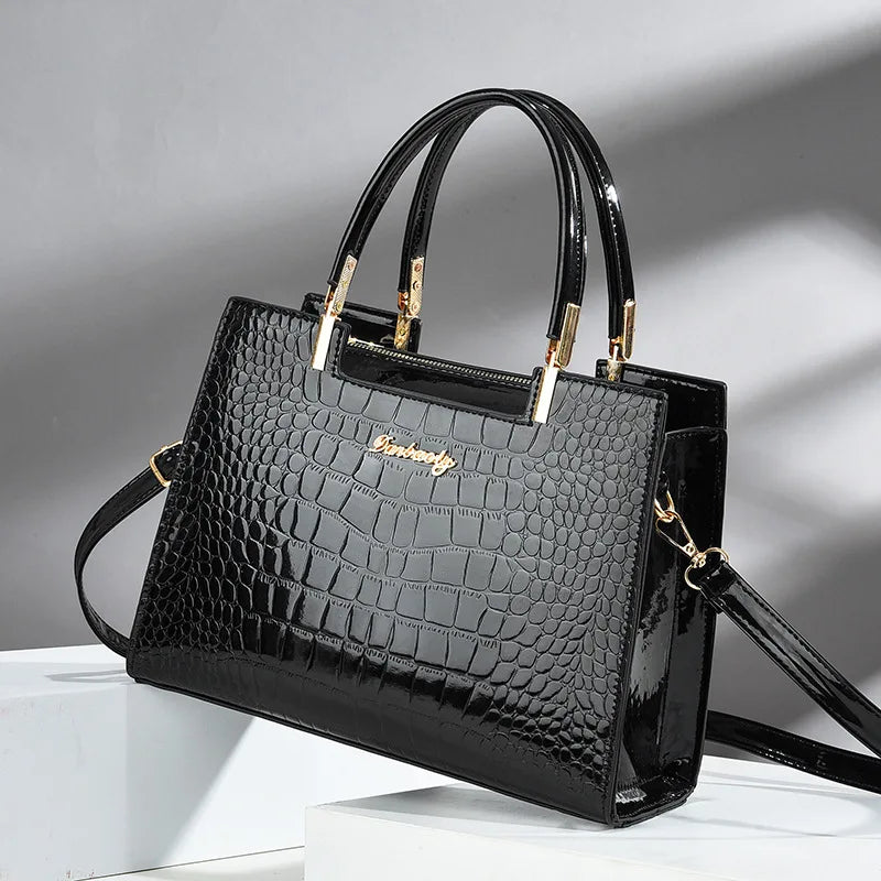 Wilja | Shiny leather handbag with crocodile pattern